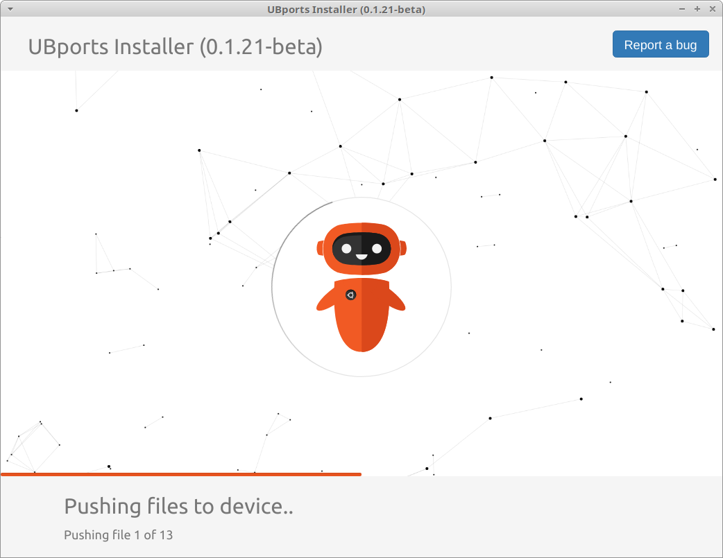 A screenshot of the UBports installer application, showing the installation running successfully with a 'Pushing files to device...' notice.